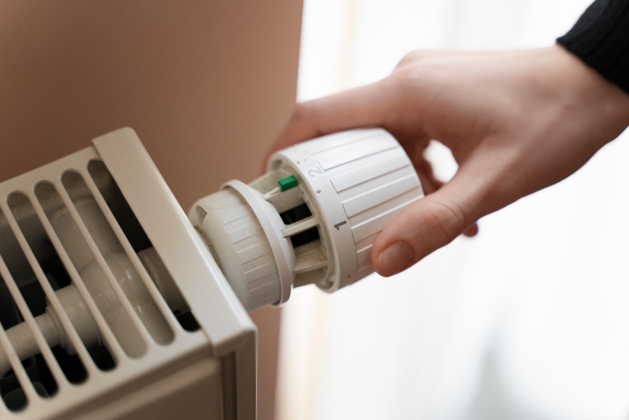 close-up-hand-turning-up-heater (1)